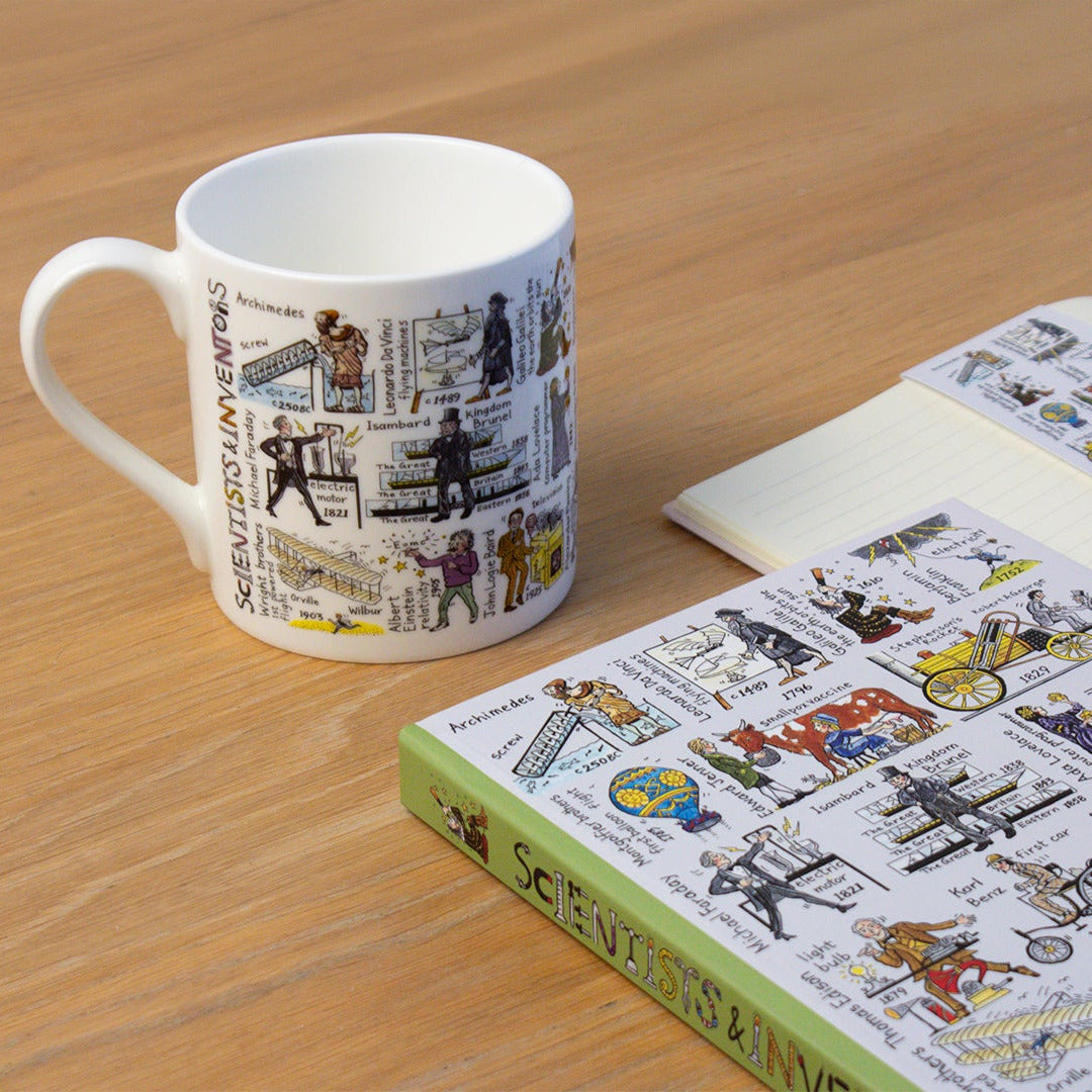 Mug and book with illustrations on a wooden surface